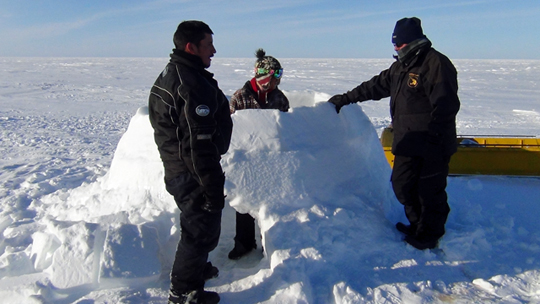 Building an igloo for a night on the tundra.