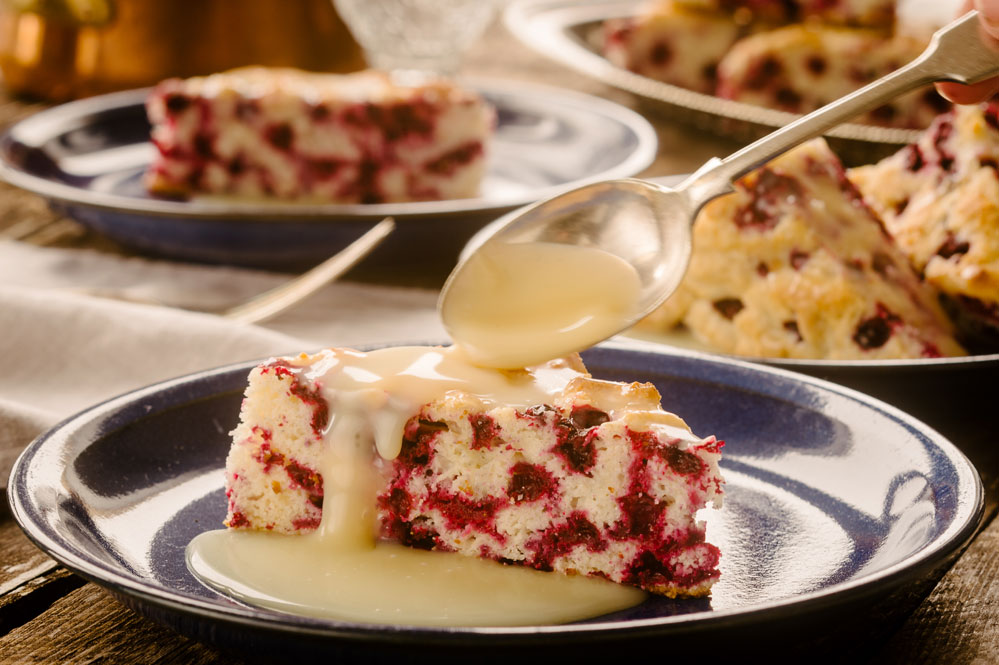 Wild Arctic Cranberry Cake with Warm Butter Sauce. Photo courtesy of Shel Zolkewich and Ian McCausland.
