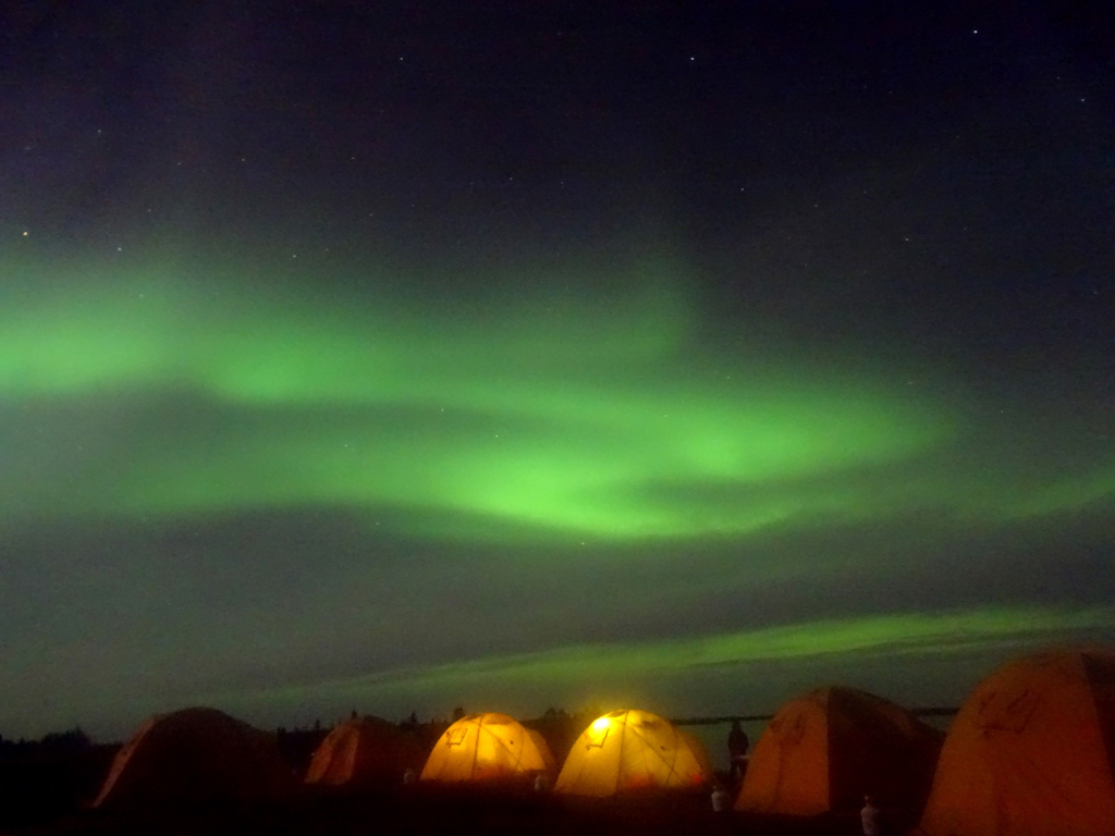 Tundra camp under the northern lights at Schmok Lake. Click image for story.