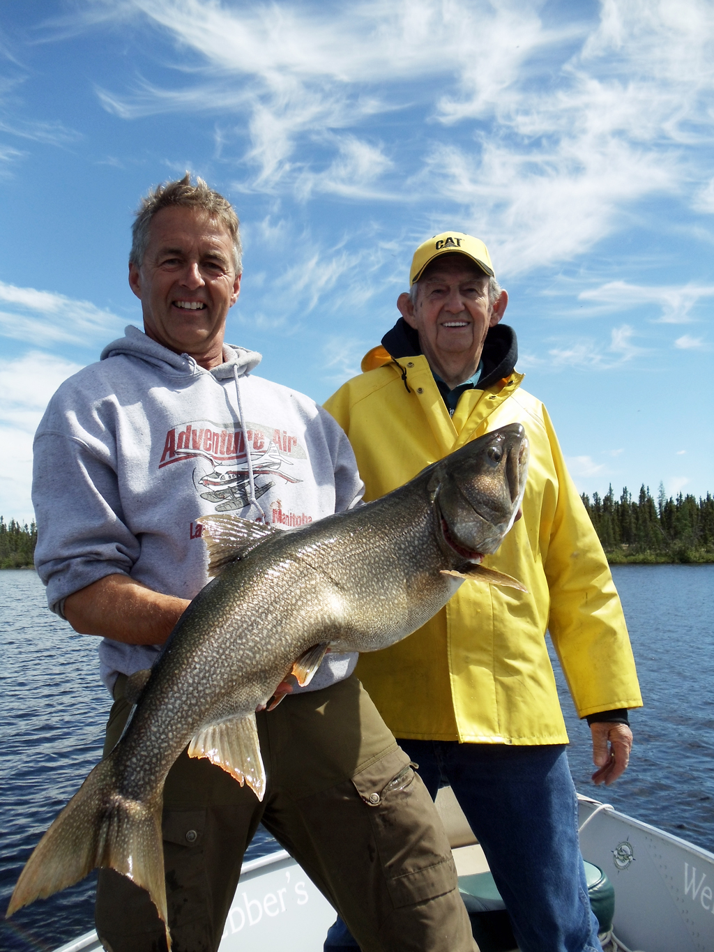 Mike Reimer and Dad Melvin with another trophy laker at North Knife Lake Lodge. Nice catch Dad!