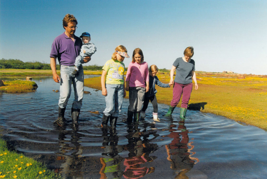 Early days at Seal River. Reimer family walk on the Hudson Bay coast.