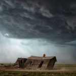 Old house in a storm by Robert Postma.