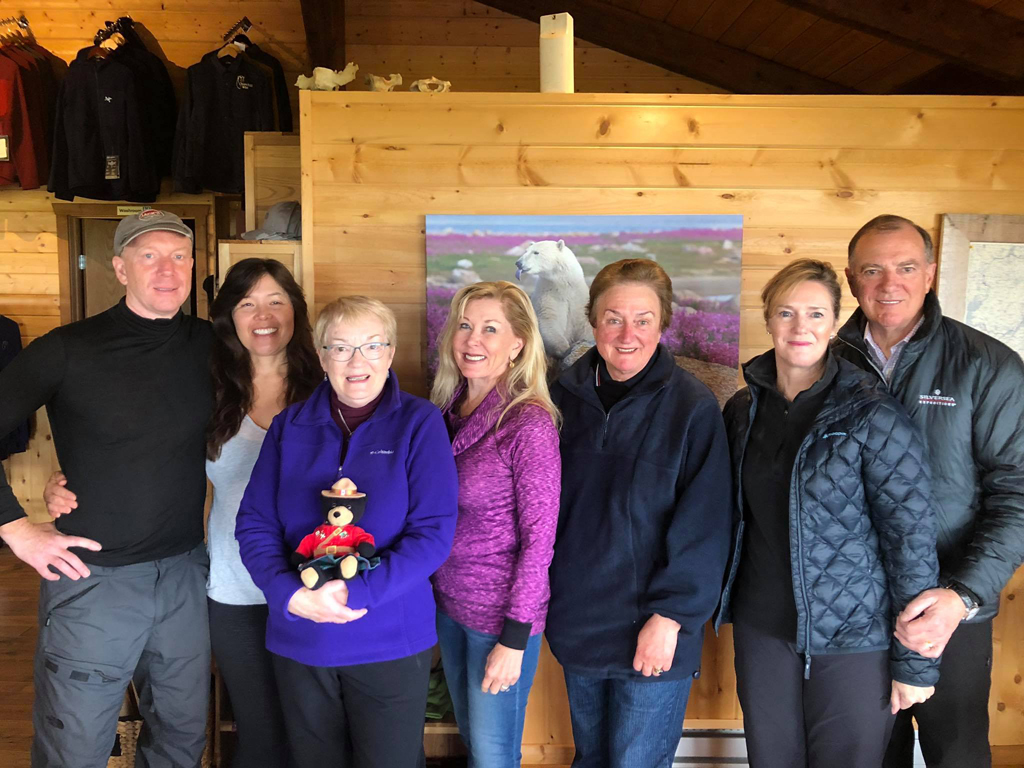 Dynie Sanderson (center, in purple) with new friends at Nanuk Polar Bear Lodge.