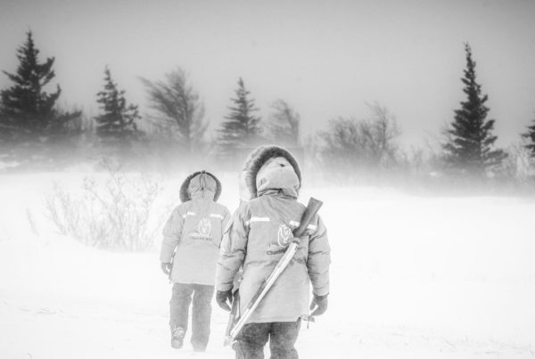 Walking in a blizzard at Nanuk Polar Bear Lodge.