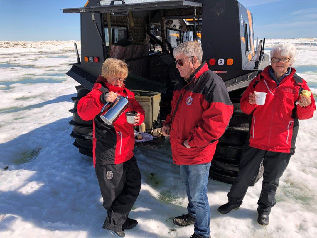 Jeanne Reimer, Doug and Helen Webber enjoy coffee and Baileys on the edge of the ice floe.