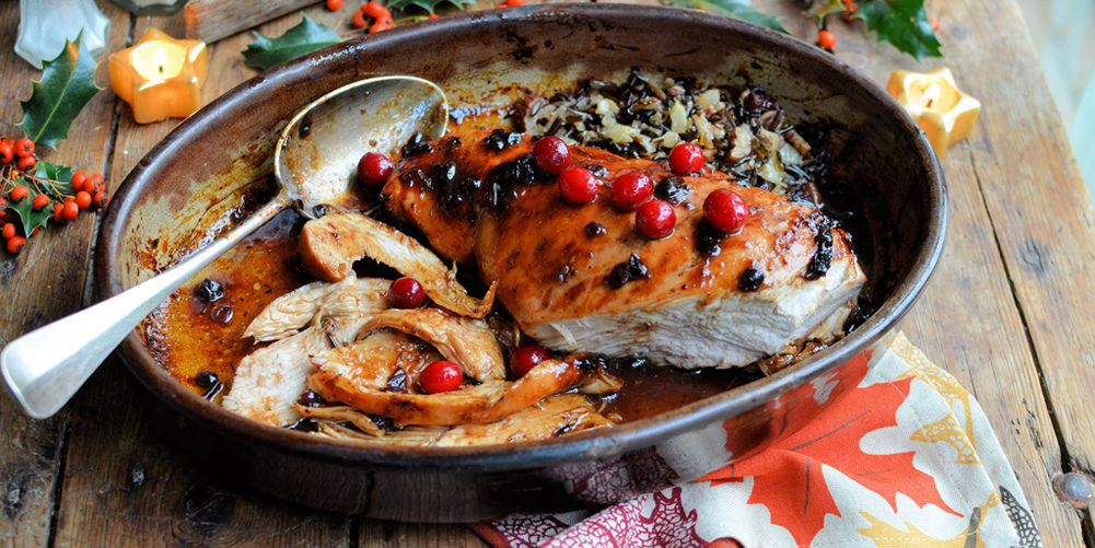 Cranberry glazed turkey breast with wild rice stuffing.
