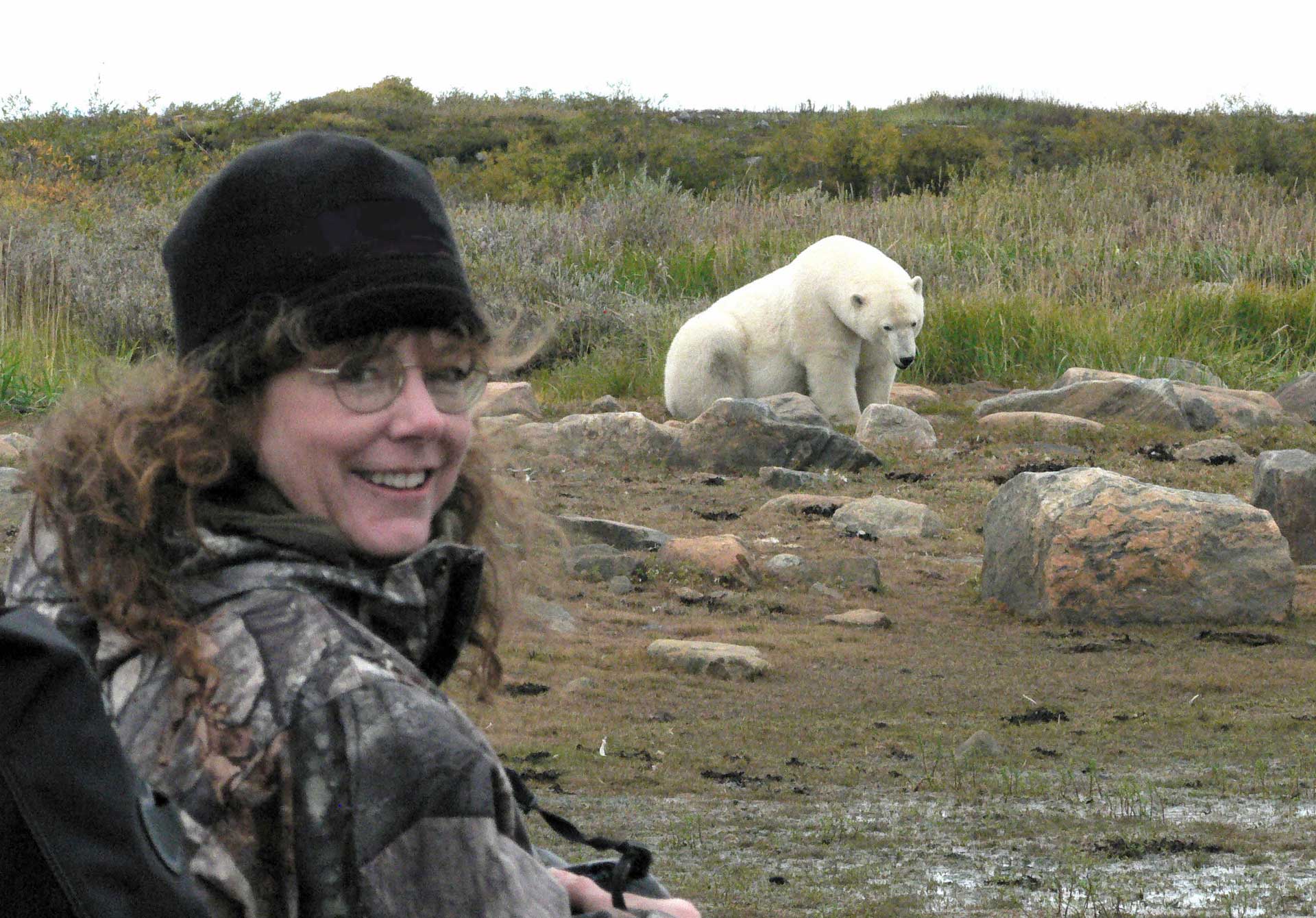 Wildlife artist Linda Besse meets a polar bear at Seal River Heritage Lodge.