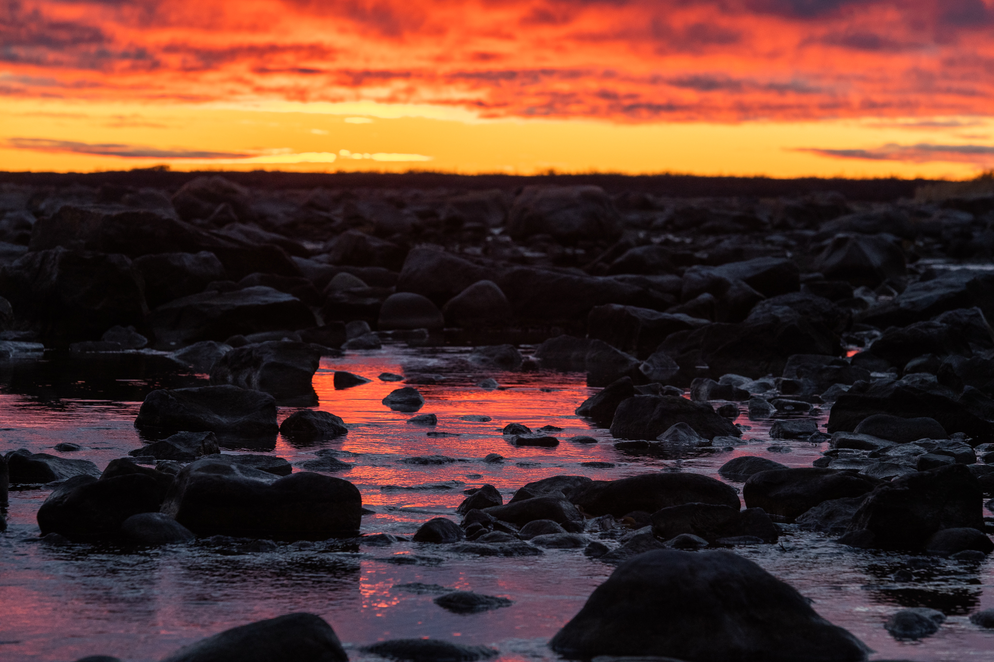 Sunset over the Hudson Bay. Seal River Heritage Lodge. Jason Okazaki photo.
