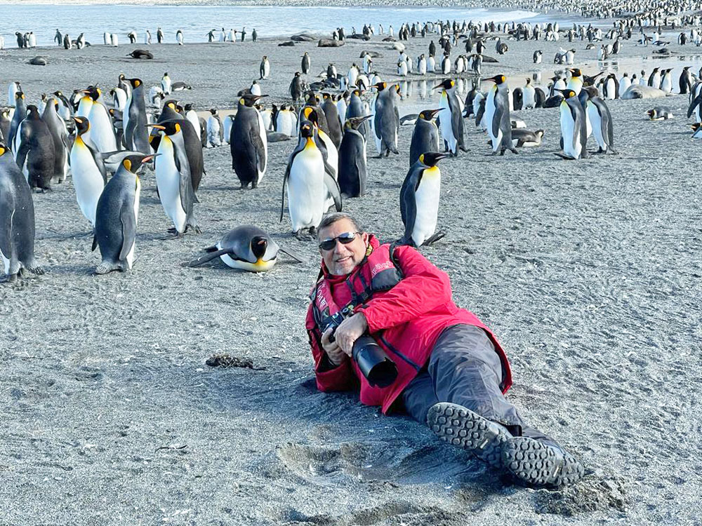 Steve Pressman with penguin friends in Antarctica.