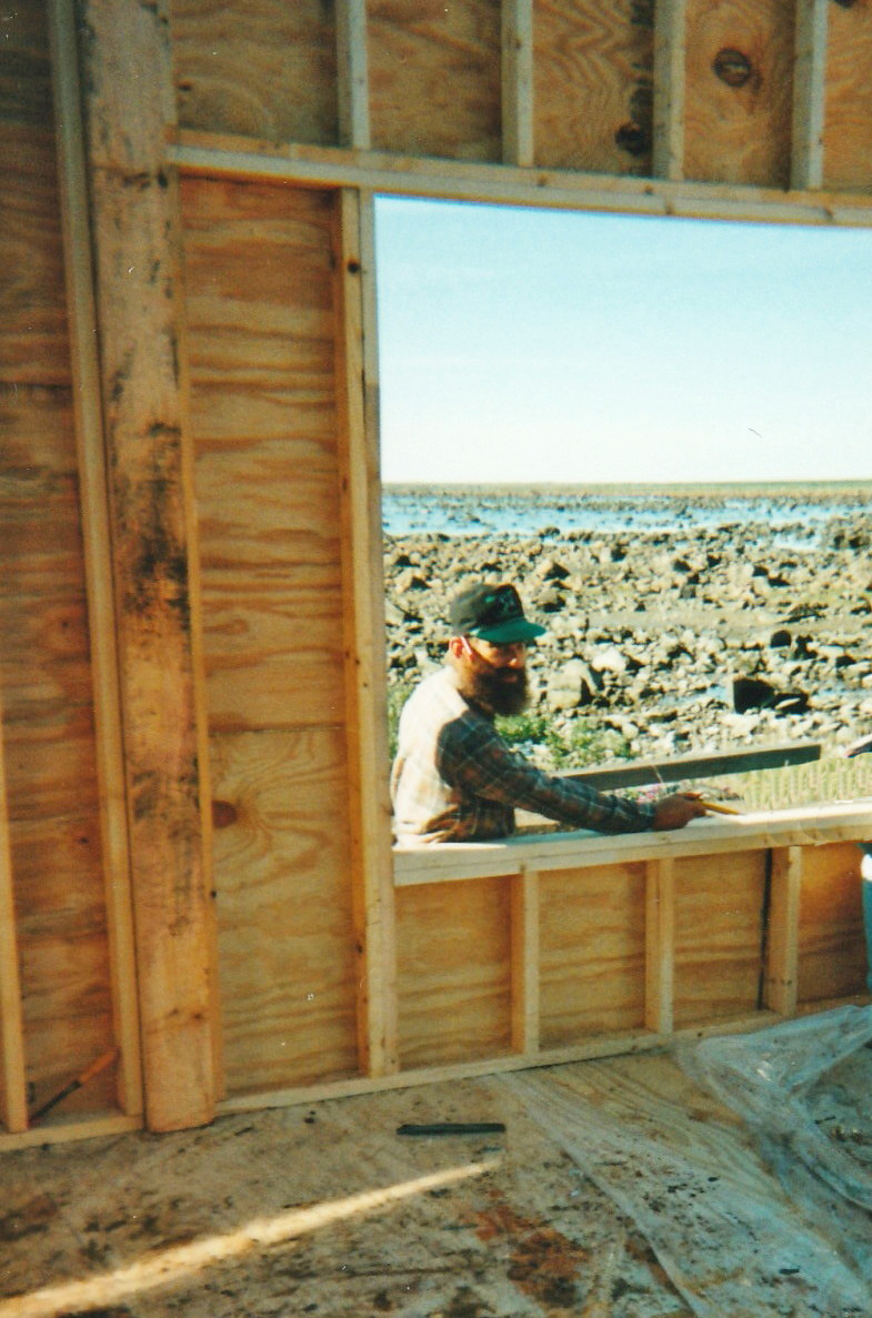 Master craftsman Len Friesen looks into the new breezeway at Seal River Heritage Lodge in 1998. Elaine Friesen photo.