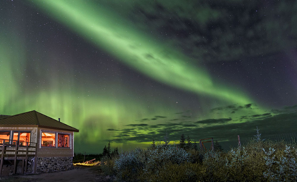 Northern lights over Nanuk Polar Bear Lodge. Charles Glatzer photo.
