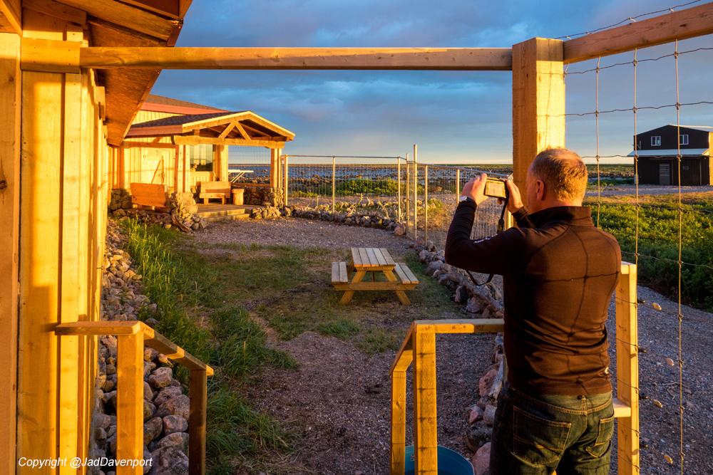 Photographing the entrance to the new timber frame lounge at Seal River Heritage Lodge. Jad Davenport photo.