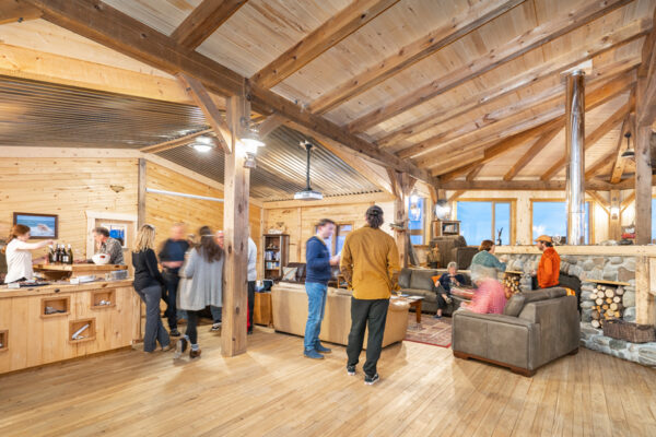 Guests in the new timber frame lounge at Seal River Heritage Lodge. Scott Zielke photo.