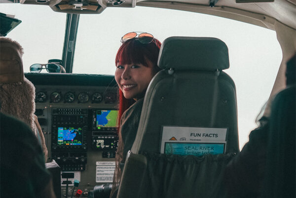 Polly Chan in front of plane