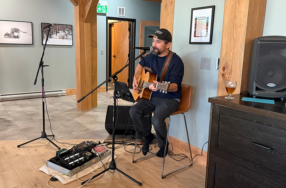 Local musician, Roy Mexted, singing at the Grand Opening of the Blueberry Inn in Churchill, Manitoba.