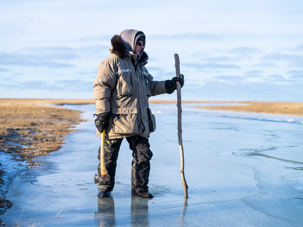 Churchill Wild co-owner and founder Mike Reimer surveying the semi-frozen landscape at Nanuk Polar Bear Lodge.