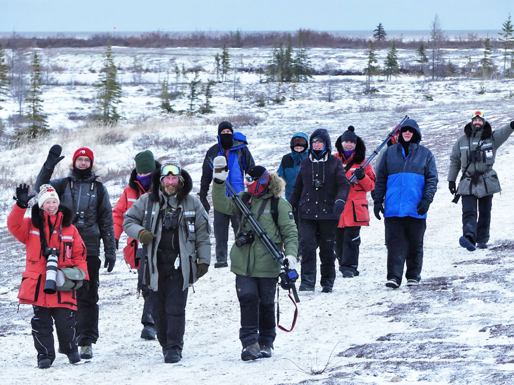 Guests returning from a walk with polar bears at Dymond Lake Ecolodge.