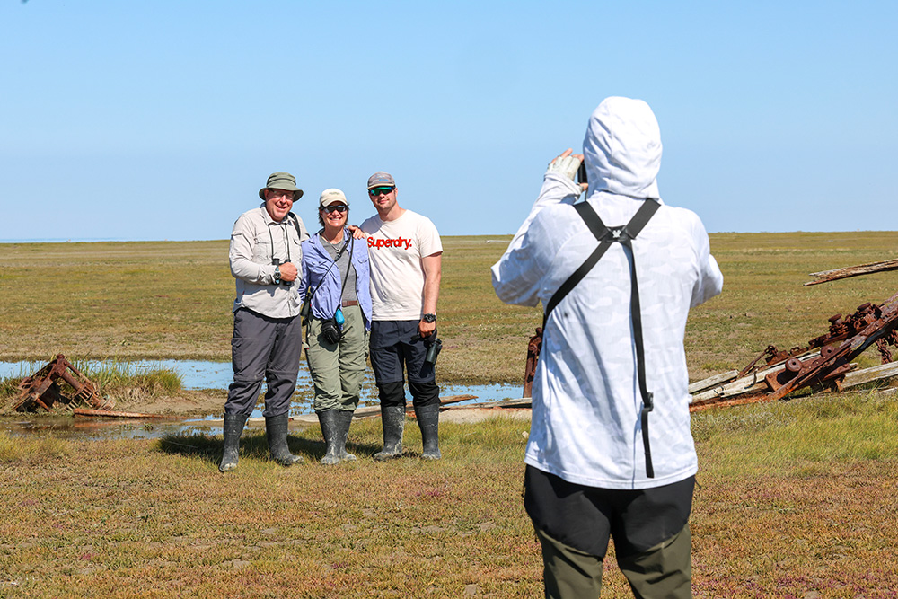 Terry Elliott photographing happy guests at Nanuk. Priscilla Downey photo.
