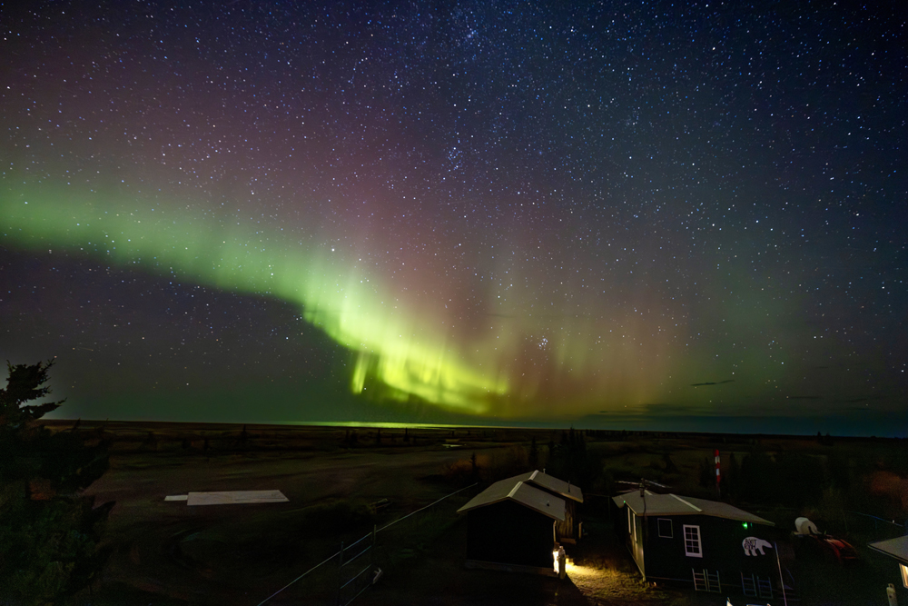 Northern Lights over Nanuk Polar Bear Lodge. Eric Wichems photo.