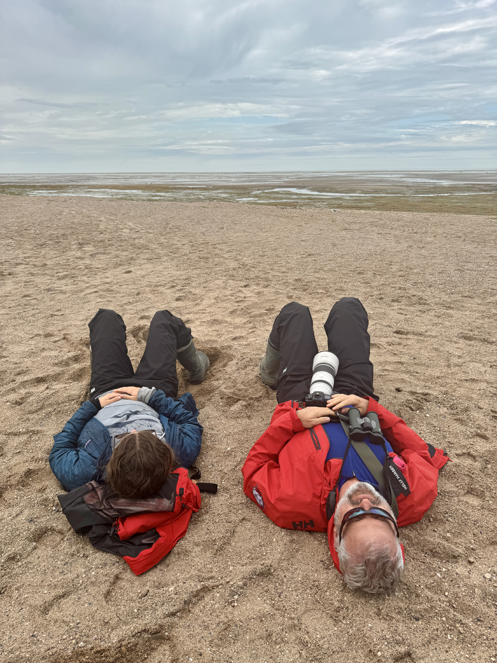 A place to think about what matters. Eric and Anna relaxing on a beach ridge at Nanuk Polar Bear Lodge.