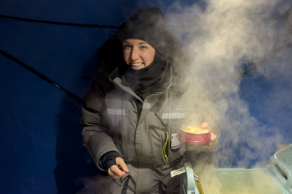 Smiles and steam for a hot meal in the field at Nanuk Polar Bear Lodge. Fabienne Jansen / ArcticWild.net photo.