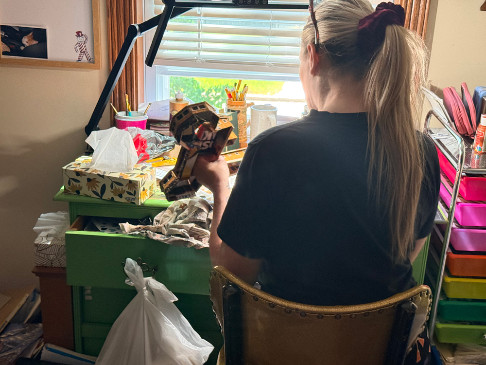 Jen hard at work creating the Seal River Heritage Lodge miniature.