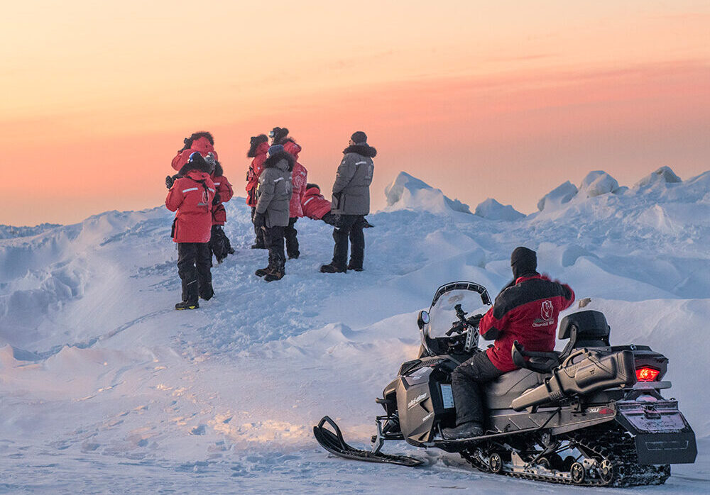 Guests on the edge of the Hudson Bay sea ice. Nanuk Polar Bear Lodge.